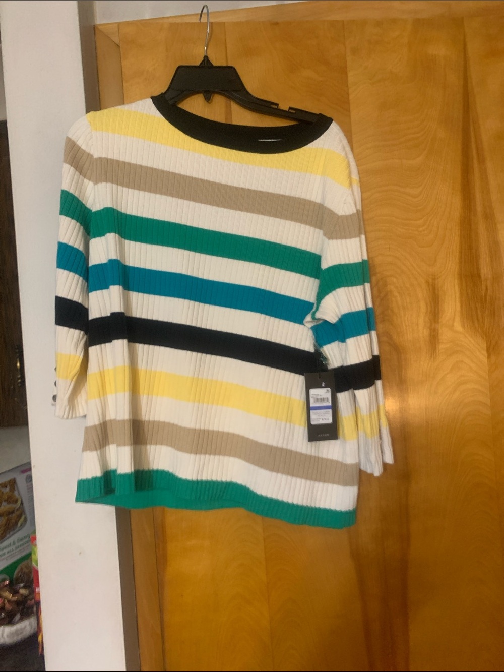Sweater. At office. I have a size large petite and xl petite